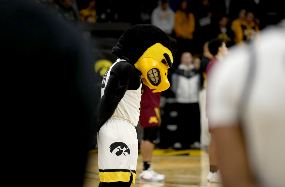 Herky The Hawk bows his head during a moment of silence for former University of Iowa Director of Athletics Bump Elliott before the Iowa Hawkeyes game against the Minnesota Golden Gophers Monday, December 9, 2019 at Carver-Hawkeye Arena. (Brian Ray/hawkeyesports.com)