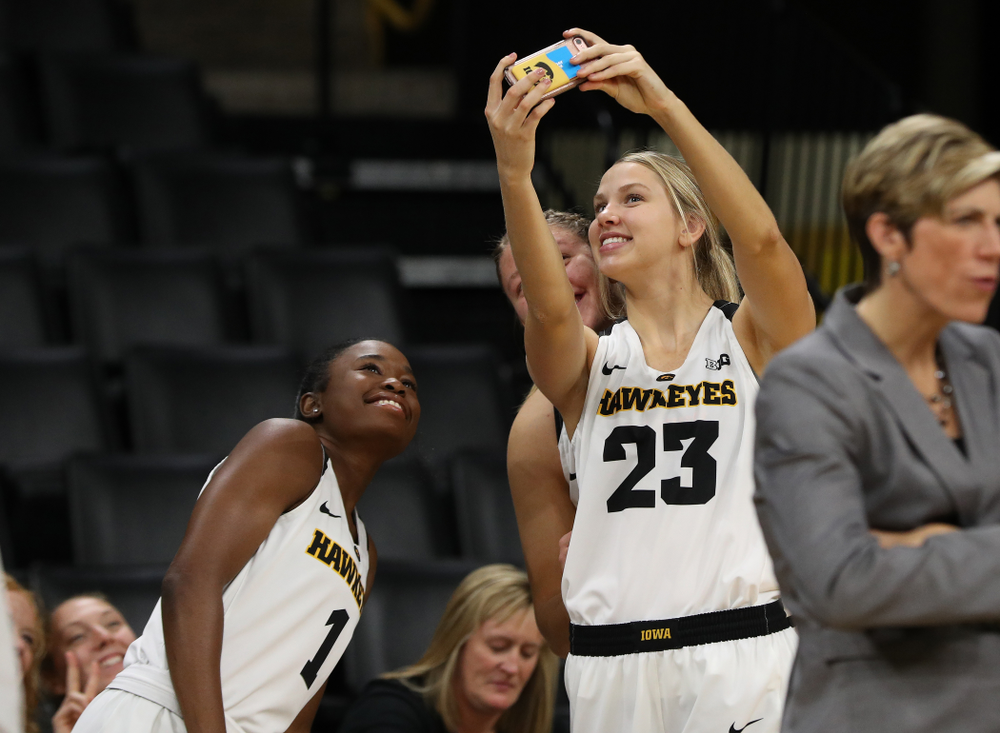 Iowa Hawkeyes forward Logan Cook (23), guard Tomi Taiwo (1), and forward/center Monika Czinano (25) during the team's annual media day Wednesday, October 31, 2018 at Carver-Hawkeye Arena. (Brian Ray/hawkeyesports.com)