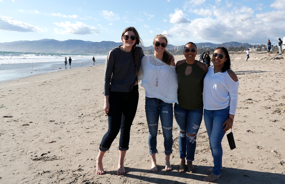 Iowa Hawkeyes guard Tania Davis (11), guard Makenzie Meyer (3), forward Megan Gustafson (10), and guard Alexis Sevillian (5) as they explore the beach Thursday, March 15, 2018 in Santa Monica. (Brian Ray/hawkeyesports.com)