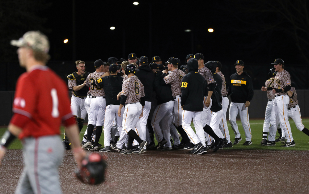 The Iowa Hawkeyes celebrate their walk off win against the Nebraska Cornhuskers on Military Appreciation Night Friday, April 19, 2019 at Duane Banks Field. (Brian Ray/hawkeyesports.com)