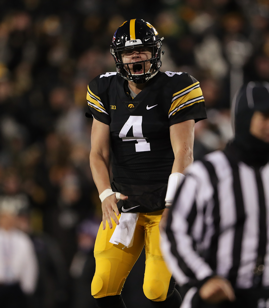 Iowa Hawkeyes quarterback Nate Stanley (4) celebrates a touchdown against the Northwestern Wildcats Saturday, November 10, 2018 at Kinnick Stadium. (Brian Ray/hawkeyesports.com)