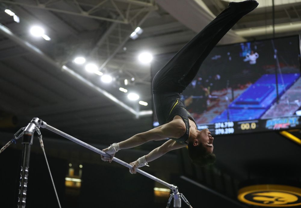 Iowa's Andrew Herrador competes on the high bar against the Ohio State Buckeyes Saturday, March 16, 2019 at Carver-Hawkeye Arena. (Brian Ray/hawkeyesports.com)