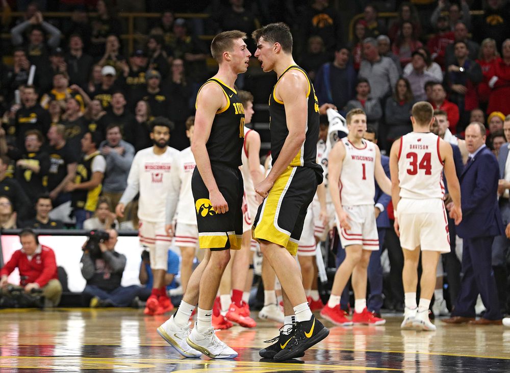 Iowa Hawkeyes guard Joe Wieskamp (10) and center Luka Garza (55) celebrate as they walk back to the bench for a timeout during the second half of their game at Carver-Hawkeye Arena in Iowa City on Monday, January 27, 2020. (Stephen Mally/hawkeyesports.com)