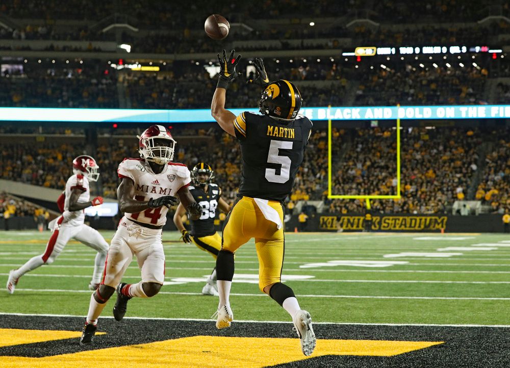 Iowa Hawkeyes wide receiver Oliver Martin (5) pulls in a 9-yard touchdown reception during the third quarter of their game at Kinnick Stadium in Iowa City on Saturday, Aug 31, 2019. (Stephen Mally/hawkeyesports.com)