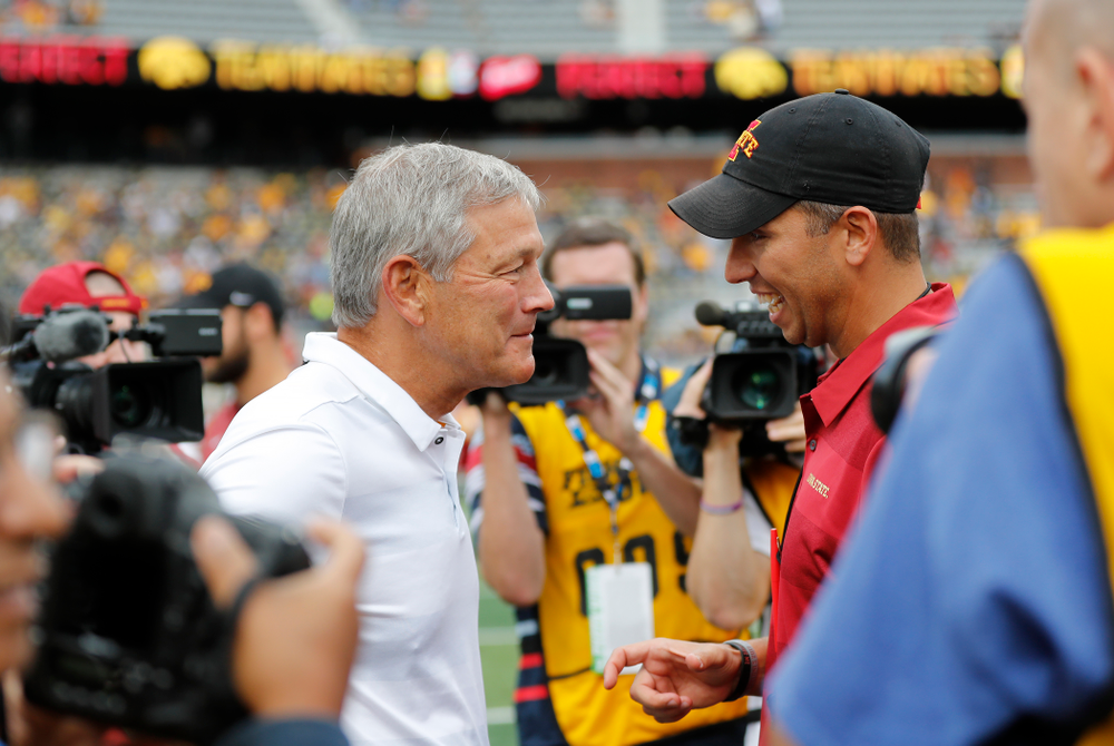 Iowa Hawkeyes head coach Kirk Ferentz talks with Iowa State Cyclones head coach Matt Campbell before their game Saturday, September 8, 2018 at Kinnick Stadium. (Brian Ray/hawkeyesports.com)