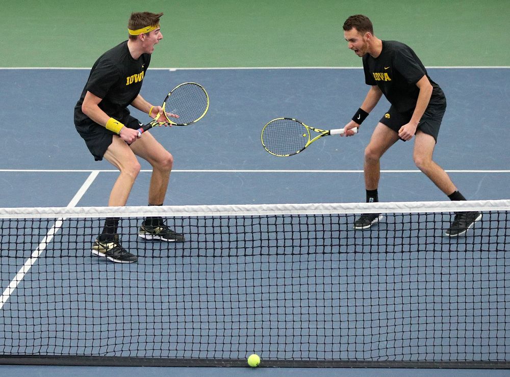 Iowa’s Nikita Snezhko (from left) and Kareem Allaf celebrate a point during their doubles match against Marquette at the Hawkeye Tennis and Recreation Complex in Iowa City on Saturday, January 25, 2020. (Stephen Mally/hawkeyesports.com)