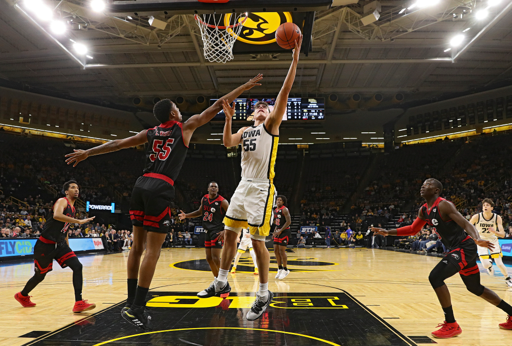 Iowa Hawkeyes center Luka Garza (55) scores a basket in the paint during the first half of their game at Carver-Hawkeye Arena in Iowa City on Friday, Nov 8, 2019. (Stephen Mally/hawkeyesports.com)