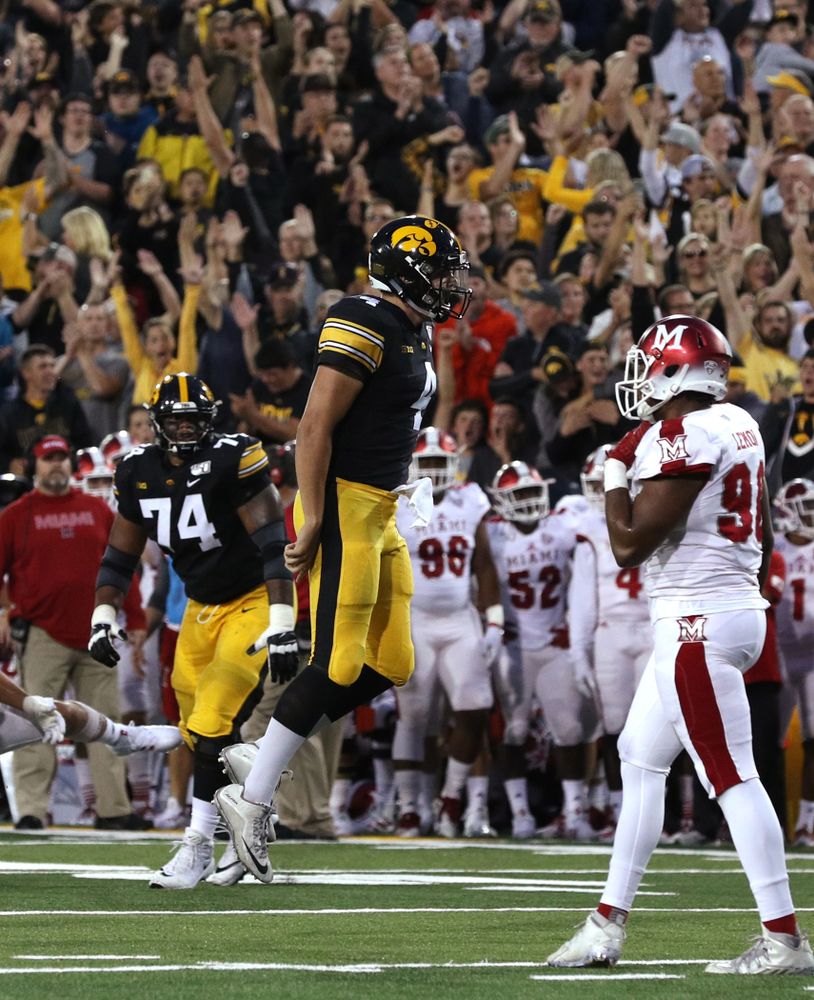 Iowa Hawkeyes quarterback Nate Stanley (4) celebrates a touchdown against the Miami RedHawks Saturday, August 31, 2019 at Kinnick Stadium in Iowa City. (Brian Ray/hawkeyesports.com)