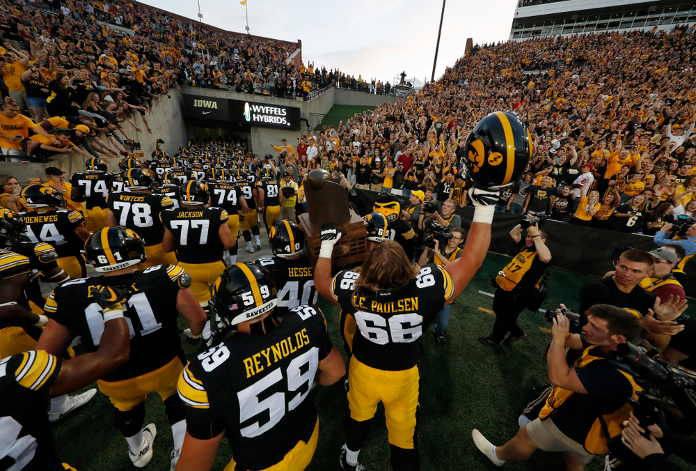 The Iowa Hawkeyes celebrate with the Cy-Hawk trophy following their game against the Iowa State Cyclones Saturday, September 8, 2018 at Kinnick Stadium. (Brian Ray/hawkeyesports.com)