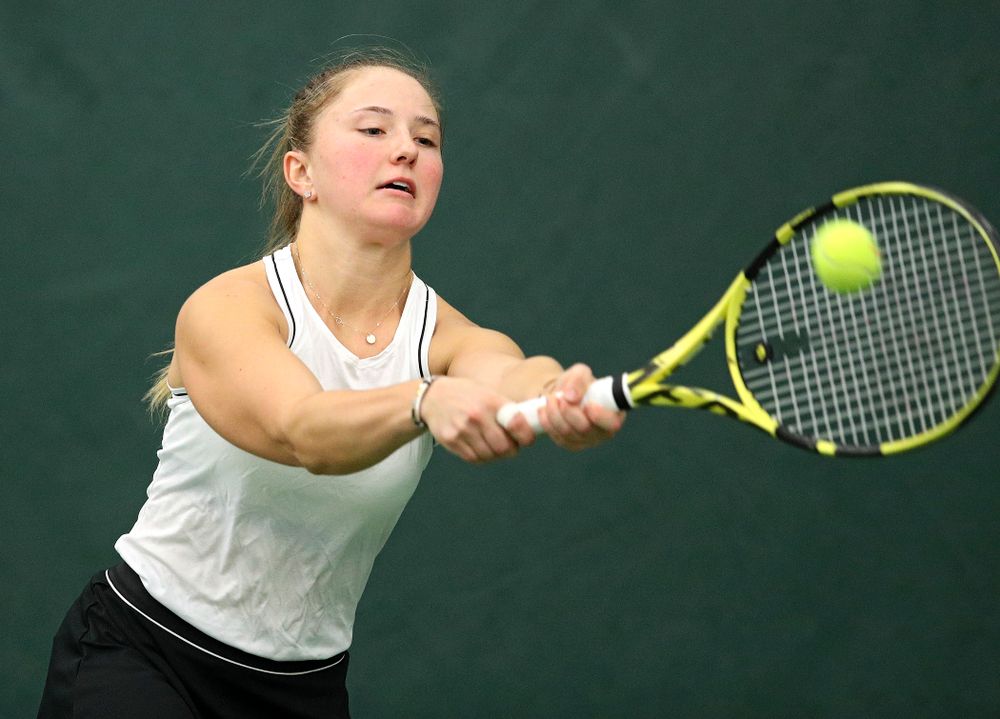 Iowa’s Danielle Burich returns a shot during her doubles match at the Hawkeye Tennis and Recreation Complex in Iowa City on Sunday, February 16, 2020. (Stephen Mally/hawkeyesports.com)