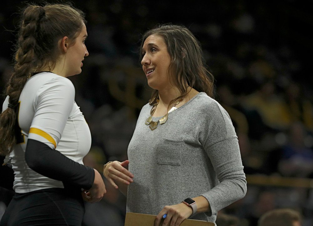 Iowa’s Blythe Rients (from left) talks with assistant coach Bre Payton during the fourth set of their match at Carver-Hawkeye Arena in Iowa City on Saturday, Nov 30, 2019. (Stephen Mally/hawkeyesports.com)