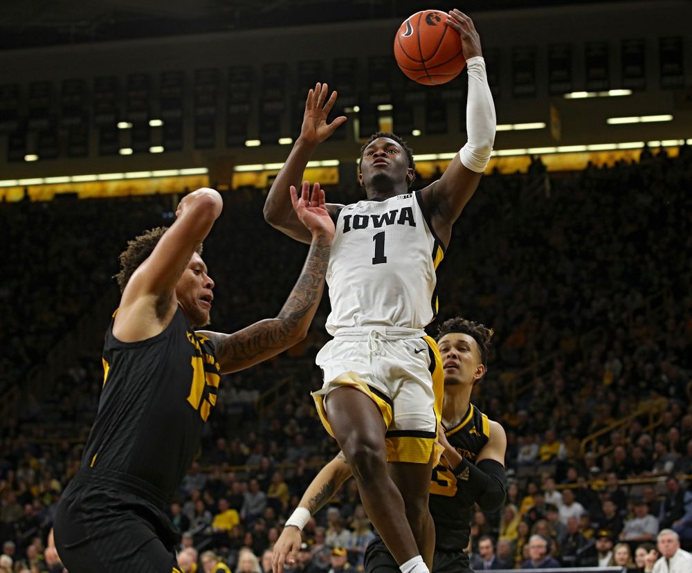 Iowa Hawkeyes guard Joe Toussaint (1) puts up a shot during the first half of their their game at Carver-Hawkeye Arena in Iowa City on Sunday, December 29, 2019. (Stephen Mally/hawkeyesports.com)