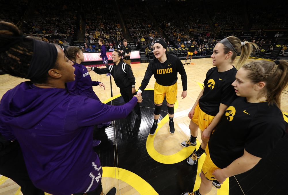 Iowa Hawkeyes forward Megan Gustafson (10), forward Hannah Stewart (21), guard Kathleen Doyle (22) against the Northwestern Wildcats Sunday, March 3, 2019 at Carver-Hawkeye Arena. (Brian Ray/hawkeyesports.com)