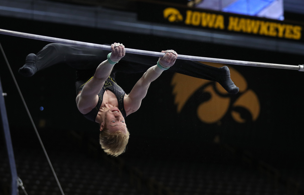 Iowa's Nick Merryman competes on the high bar against the Ohio State Buckeyes Saturday, March 16, 2019 at Carver-Hawkeye Arena. (Brian Ray/hawkeyesports.com)