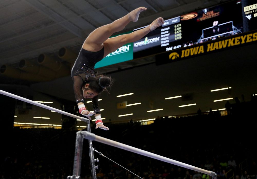 Iowa’s Clair Kaji competes on the bars against Michigan Friday, February 14, 2020 at Carver-Hawkeye Arena. (Brian Ray/hawkeyesports.com)