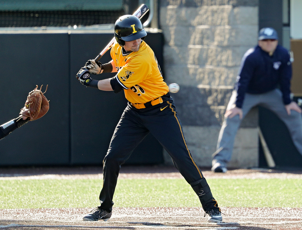 Iowa Hawkeyes left fielder Chris Whelan (28) is hit by a pitch during the second inning of their game at Duane Banks Field in Iowa City on Tuesday, Apr. 2, 2019. (Stephen Mally/hawkeyesports.com)