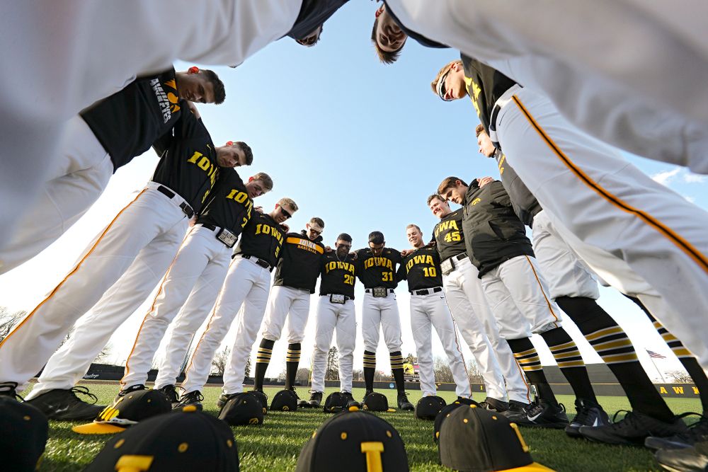 The Hawkeyes huddle before their game at Duane Banks Field in Iowa City on Tuesday, March 3, 2020. (Stephen Mally/hawkeyesports.com)