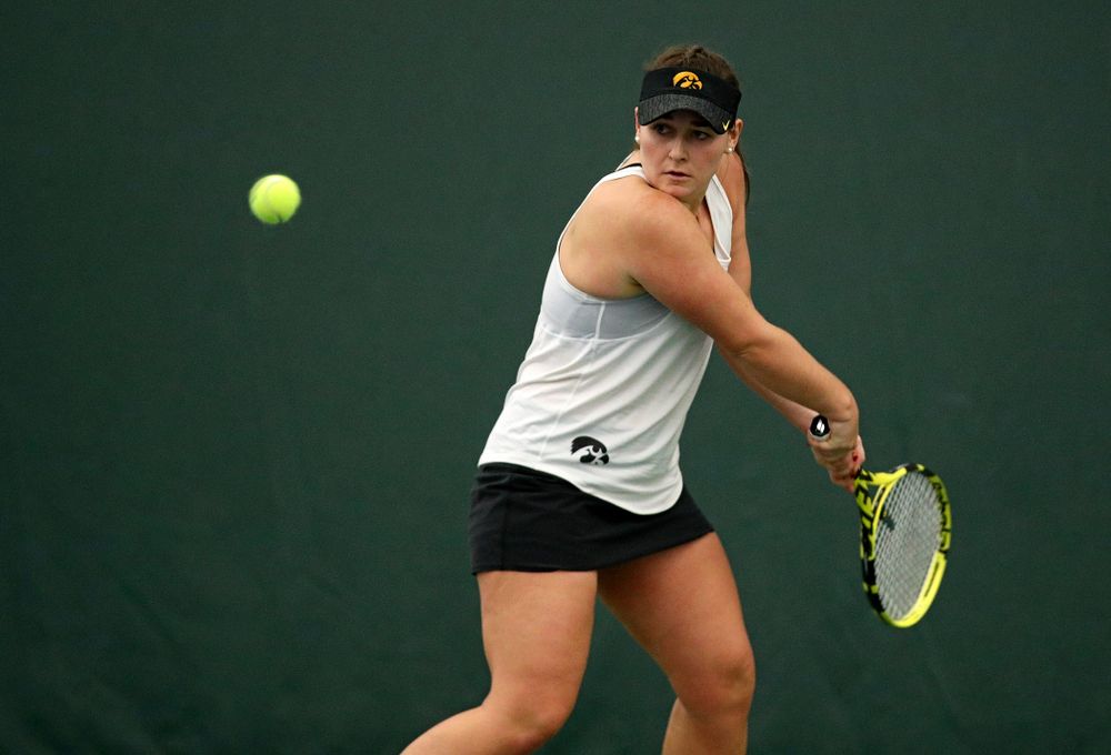 Iowa’s Danielle Bauers returns a shot during her singles match at the Hawkeye Tennis and Recreation Complex in Iowa City on Sunday, February 23, 2020. (Stephen Mally/hawkeyesports.com)