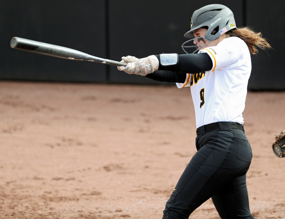 Iowa catcher Abby Lien (9) hits a home run during the second inning of their game against Illinois at Pearl Field in Iowa City on Friday, Apr. 12, 2019. (Stephen Mally/hawkeyesports.com)