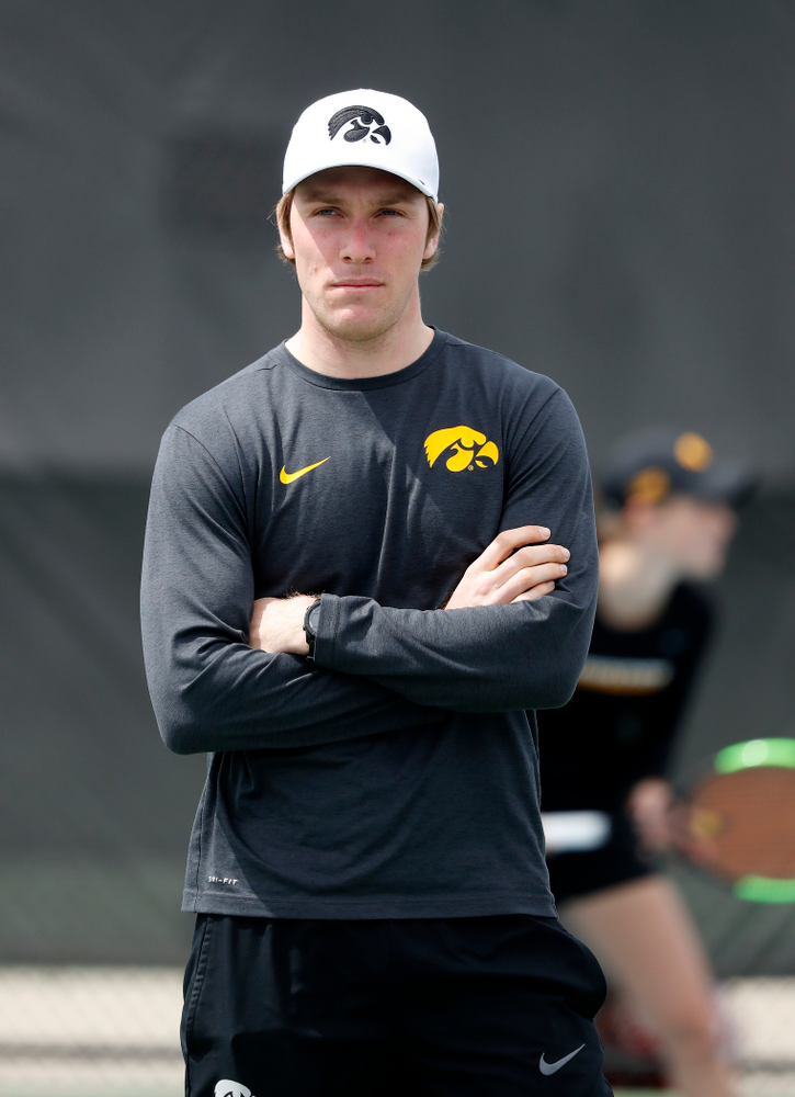 Assistant coach Daniel Leitner against the Wisconsin Badgers Sunday, April 22, 2018 at the Hawkeye Tennis and Recreation Center. (Brian Ray/hawkeyesports.com)