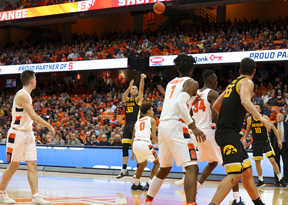 Iowa Hawkeyes guard Connor McCaffery (30) makes a 3-pointer during the second half of their ACC/Big Ten Challenge game at the Carrier Dome in Syracuse, N.Y. on Tuesday, Dec 3, 2019. (Stephen Mally/hawkeyesports.com)