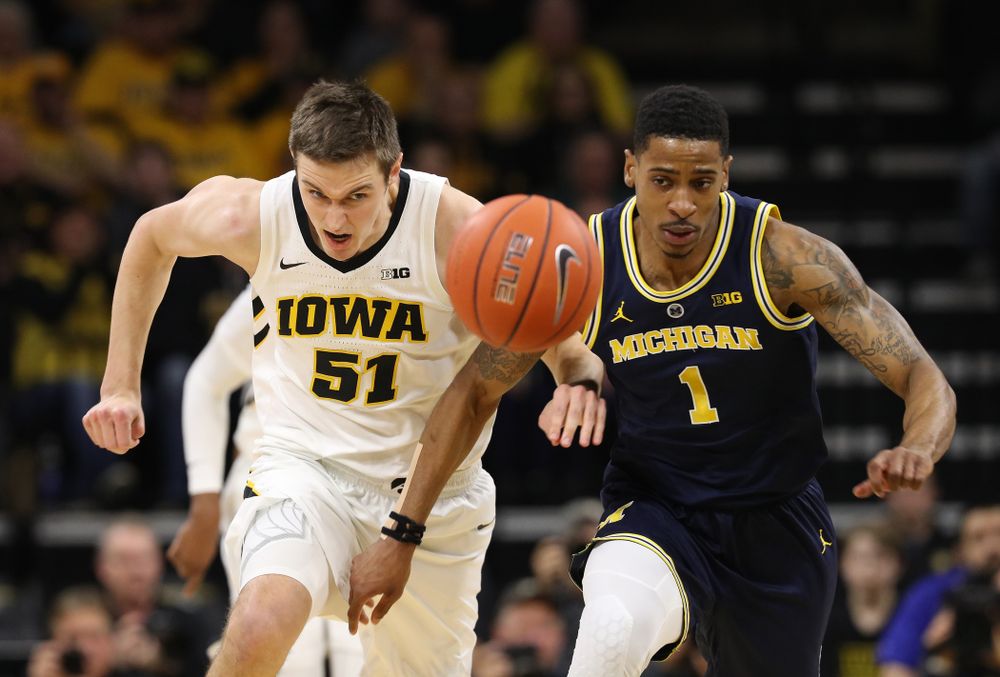 Iowa Hawkeyes forward Nicholas Baer (51) chases down a loose ball against the Michigan Wolverines Friday, February 1, 2019 at Carver-Hawkeye Arena. (Brian Ray/hawkeyesports.com)