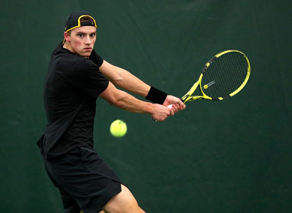 Iowa’s Joe Tyler returns a shot during his singles match at the Hawkeye Tennis and Recreation Complex in Iowa City on Friday, March 6, 2020. (Stephen Mally/hawkeyesports.com)