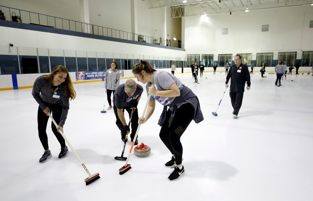 Members of the Iowa Softball team learn the sport of curling as part of a team building event Wednesday, January 10, 2018 at the Cedar Rapids Ice Arena. (Brian Ray/hawkeyesports.com)
