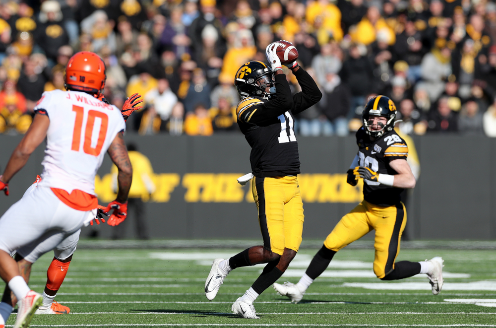 Iowa Hawkeyes defensive back Michael Ojemudia (11) intercepts a pass against the Illinois Fighting Illini Saturday, November 23, 2019 at Kinnick Stadium. (Brian Ray/hawkeyesports.com)