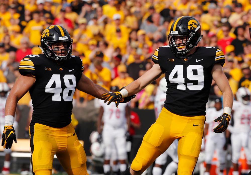 Iowa Hawkeyes linebacker Jack Hockaday (48) and linebacker Nick Niemann (49) against the Northern Illinois Huskies Saturday, September 1, 2018 at Kinnick Stadium. (Brian Ray/hawkeyesports.com)