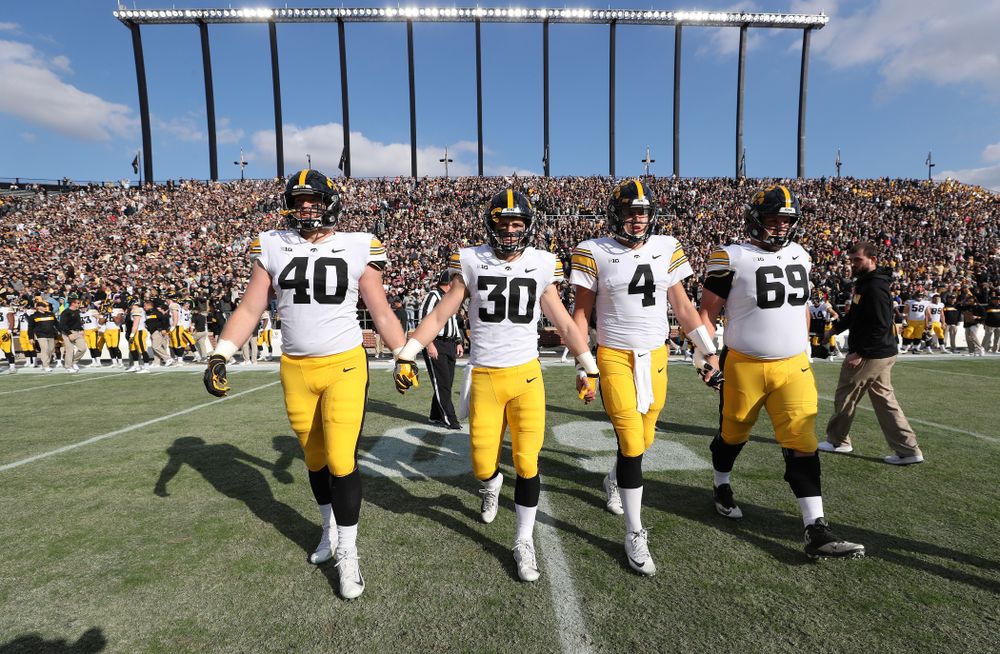 Iowa Hawkeyes captains defensive end Parker Hesse (40), defensive back Jake Gervase (30), quarterback Nate Stanley (4), and offensive lineman Keegan Render (69) against the Purdue Boilermakers Saturday, November 3, 2018 Ross Ade Stadium in West Lafayette, Ind. (Brian Ray/hawkeyesports.com)