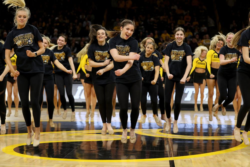 The Iowa Spirit Squad performs with participants in Spirit Squad Day at halftime of the Iowa Hawkeyes game against the Nebraska Cornhuskers Saturday, February 8, 2020 at Carver-Hawkeye Arena. (Brian Ray/hawkeyesports.com)