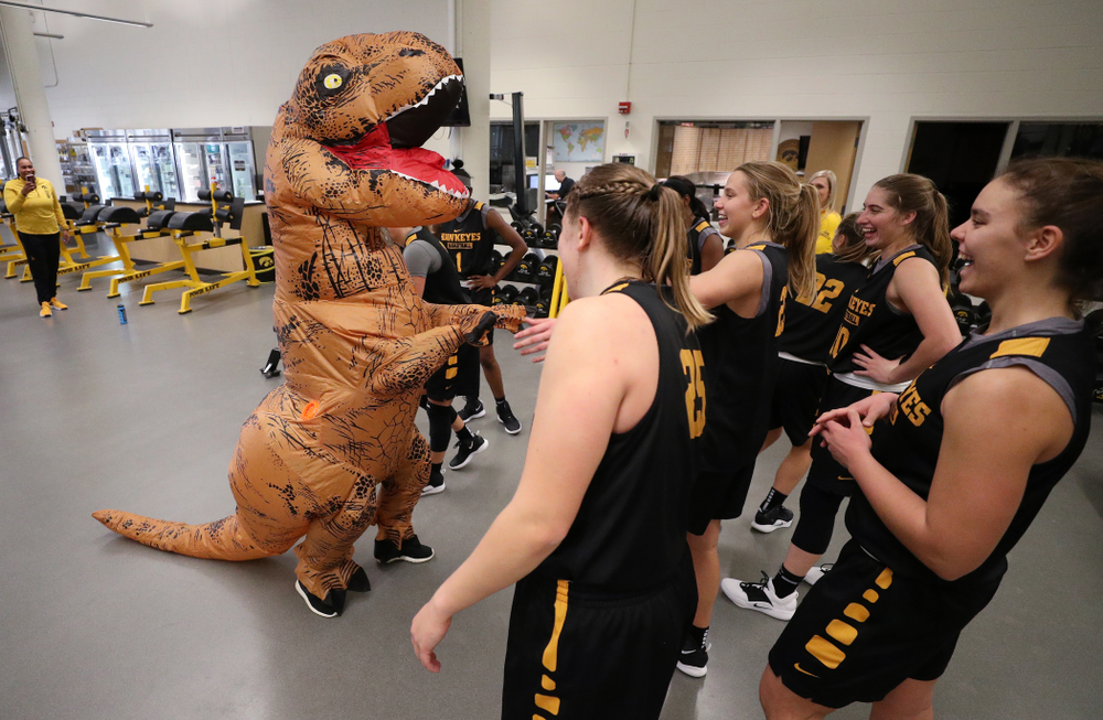 Iowa Hawkeyes head coach Lisa Bluder surprises her team during a workout dressed as a T-Rex for Halloween Wednesday, October 31, 2018 at Carver-Hawkeye Arena. (Brian Ray/hawkeyesports.com)