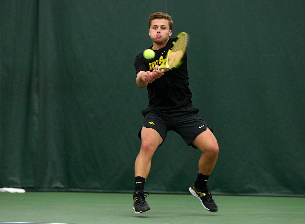 Iowa’s Will Davies returns a shot during his singles match at the Hawkeye Tennis and Recreation Complex in Iowa City on Friday, March 6, 2020. (Stephen Mally/hawkeyesports.com)