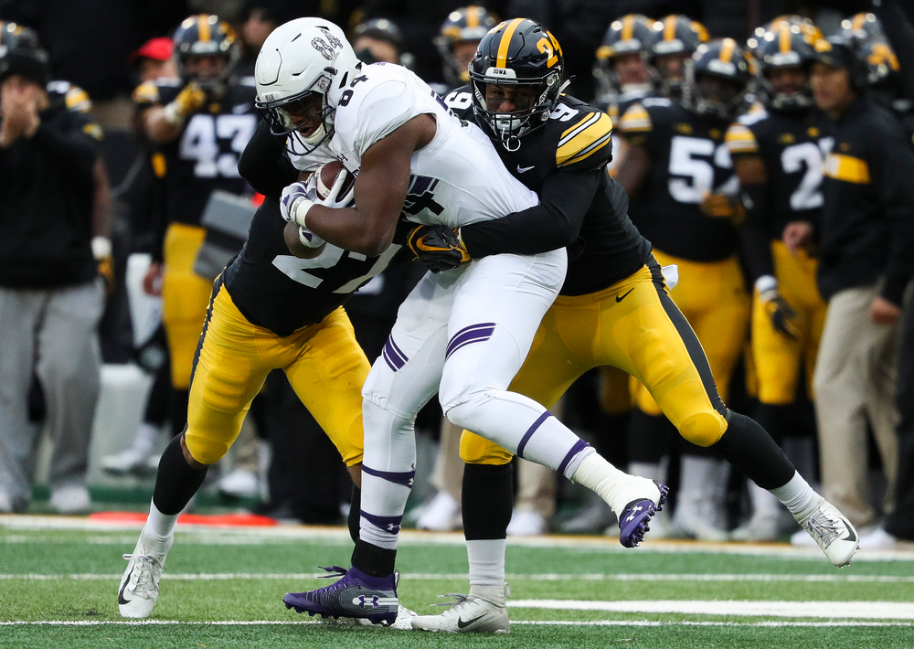 Iowa Hawkeyes defensive back Geno Stone (9) makes a tackle during a game against Northwestern at Kinnick Stadium on November 10, 2018. (Tork Mason/hawkeyesports.com)
