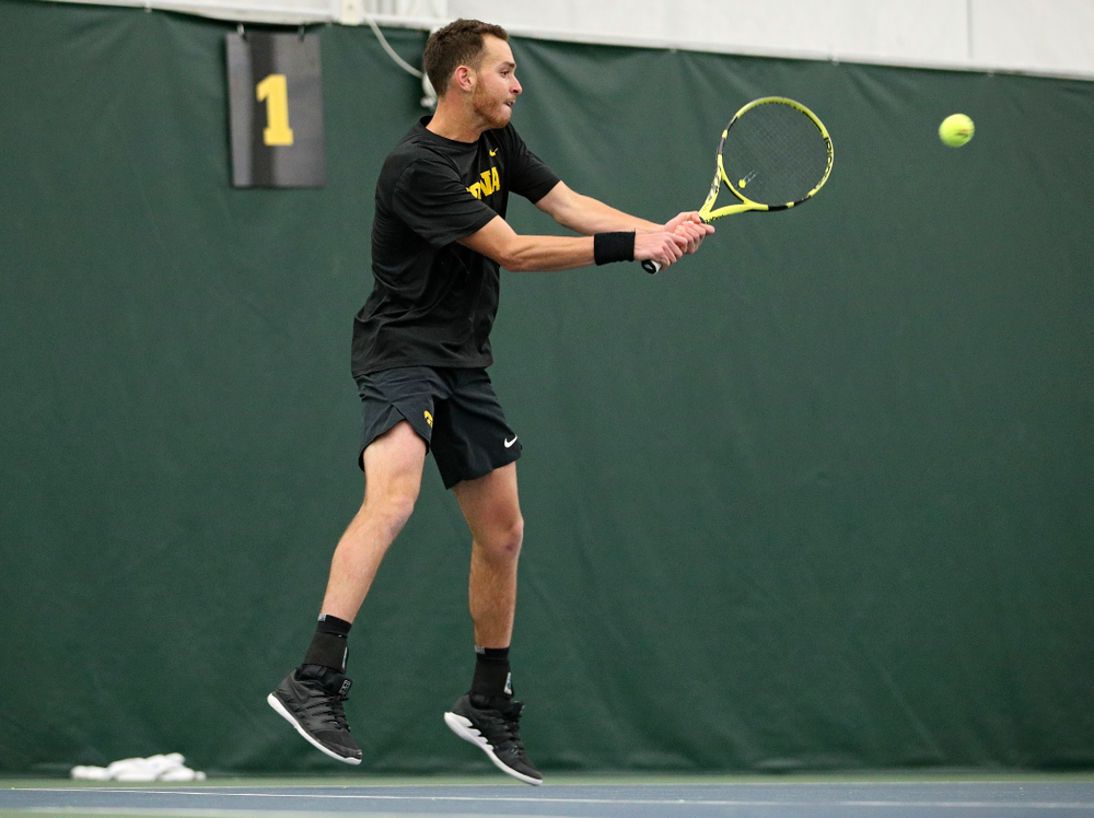 Iowa’s Kareem Allaf hits a shot during his match against Marquette at the Hawkeye Tennis and Recreation Complex in Iowa City on Saturday, January 25, 2020. (Stephen Mally/hawkeyesports.com)