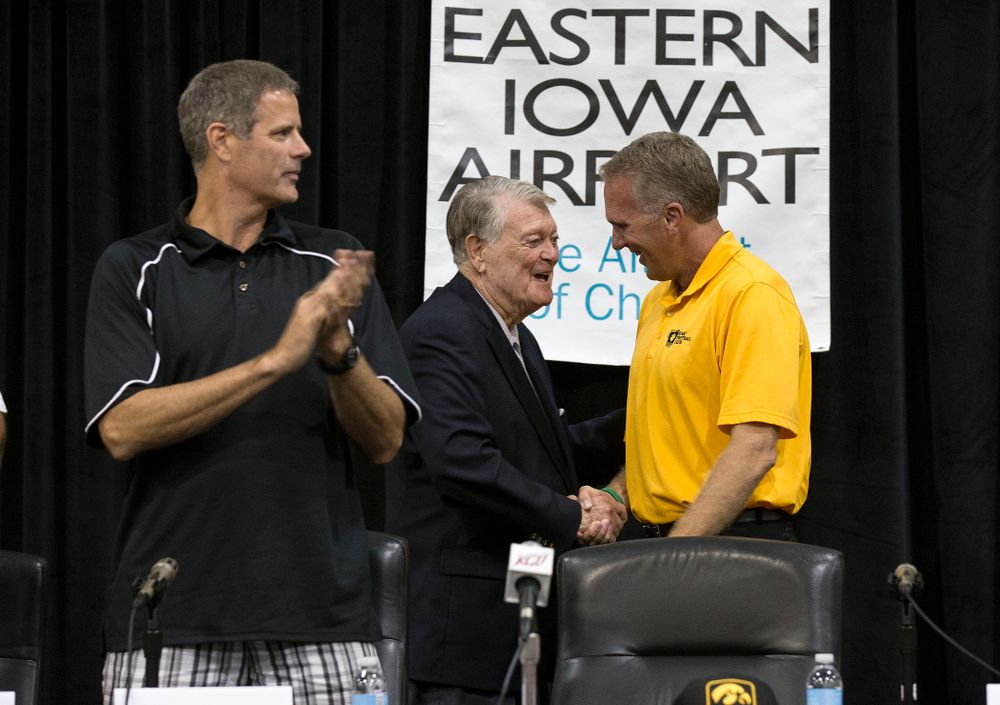 Former Hawkeye Football Head Coach Hayden Fry shakes hands with former quarterback Chuck Long during a panel discussion at Fry Fest Friday, Aug. 29, 2014 in Coralville. (Brian Ray/hawkeyesports.com)