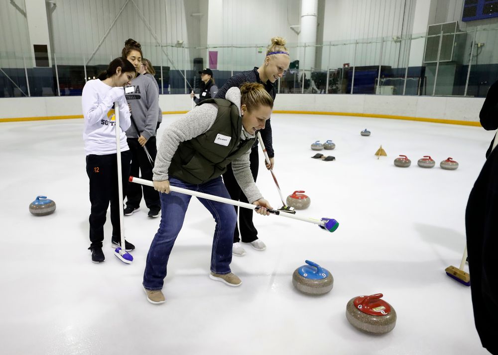 Members of the Iowa Softball team learn the sport of curling as part of a team building event Wednesday, January 10, 2018 at the Cedar Rapids Ice Arena. (Brian Ray/hawkeyesports.com)