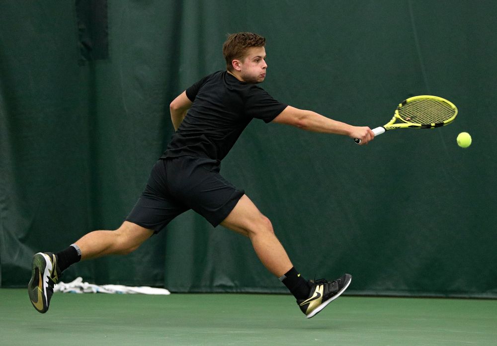 Iowa’s Will Davies returns a shot during his singles match at the Hawkeye Tennis and Recreation Complex in Iowa City on Friday, March 6, 2020. (Stephen Mally/hawkeyesports.com)