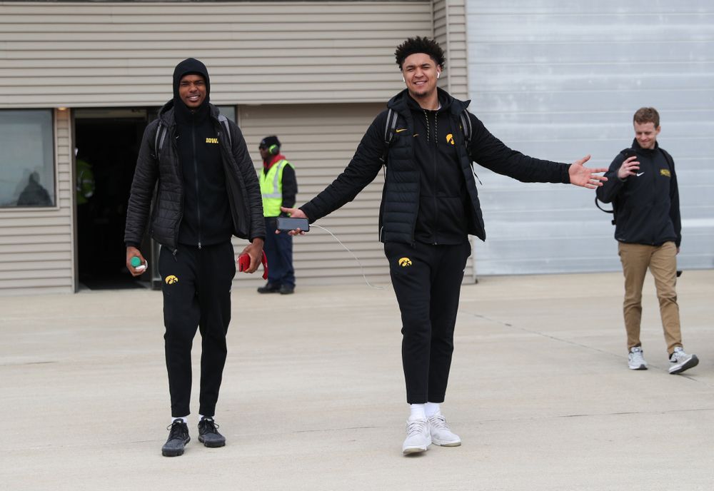 Iowa Hawkeyes forward Cordell Pemsl (35) and guard Maishe Dailey (1) board a flight to Columbus for the first and second rounds of the 2019 NCAA Men's Basketball Tournament Wednesday, March 20, 2019 at the Eastern Iowa Airport. (Brian Ray/hawkeyesports.com)