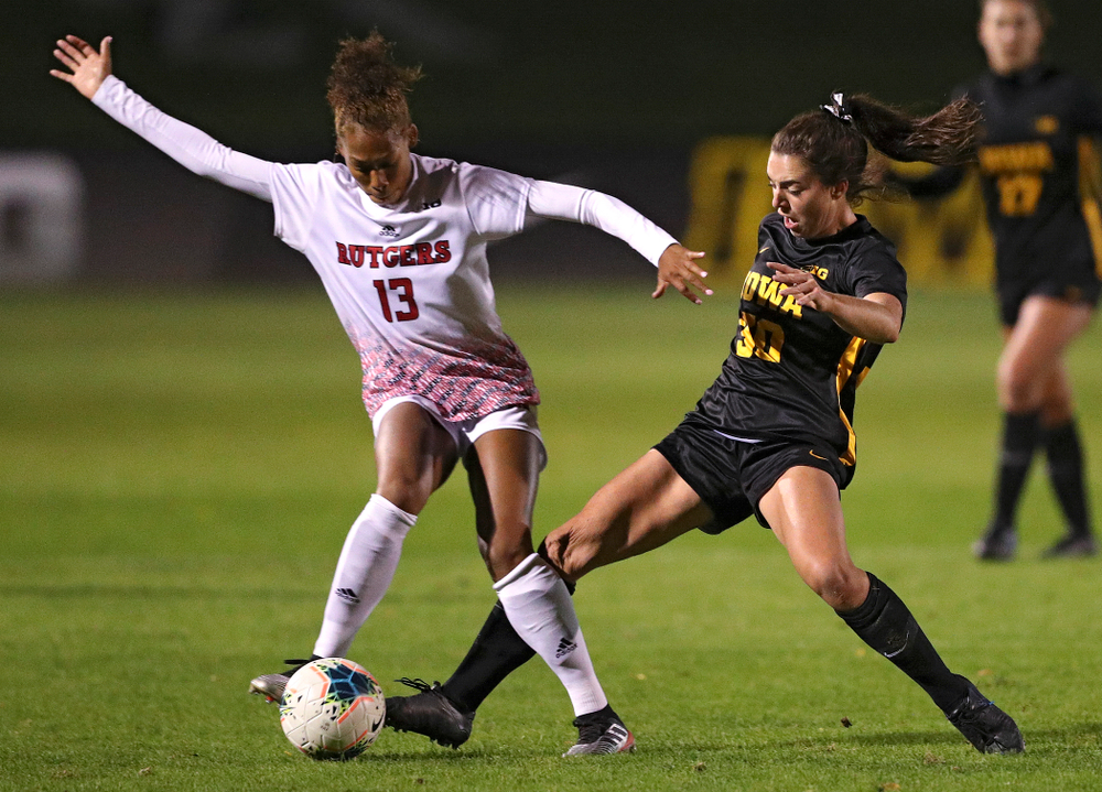 Iowa forward Devin Burns (30) tries to poke the ball away during the first half of their match at the Iowa Soccer Complex in Iowa City on Friday, Oct 11, 2019. (Stephen Mally/hawkeyesports.com)