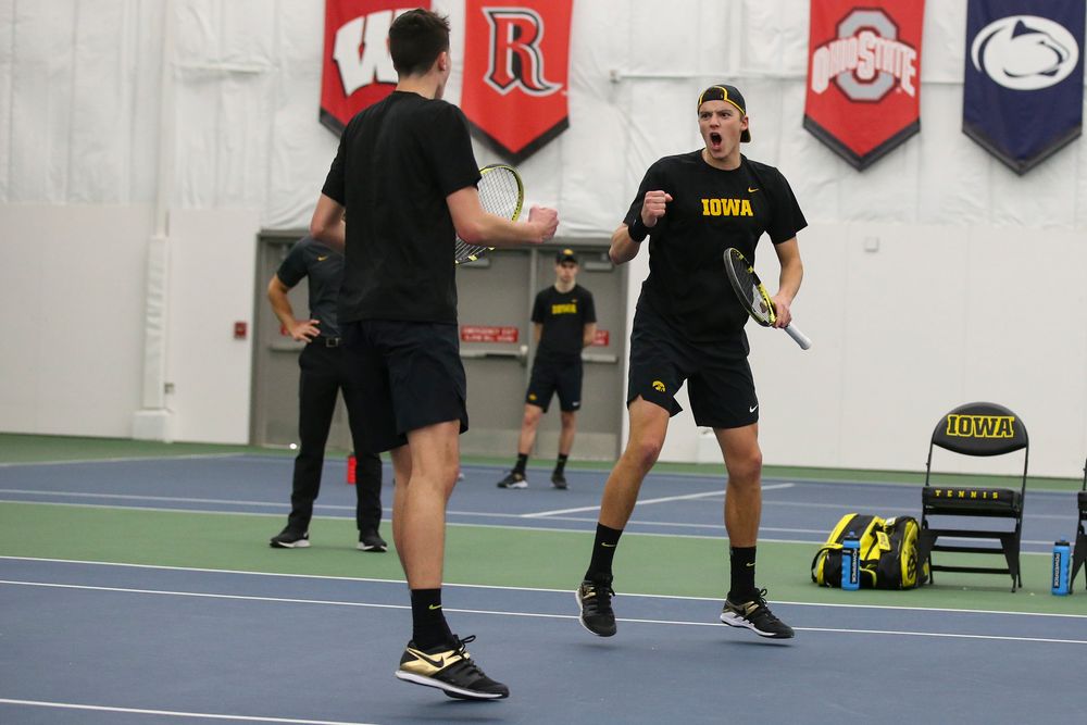 Iowa’s Matt Clegg and Joe Tyler celebrate a point during the Iowa men’s tennis meet vs VCU on Saturday, February 29, 2020 at the Hawkeye Tennis and Recreation Complex. (Lily Smith/hawkeyesports.com)