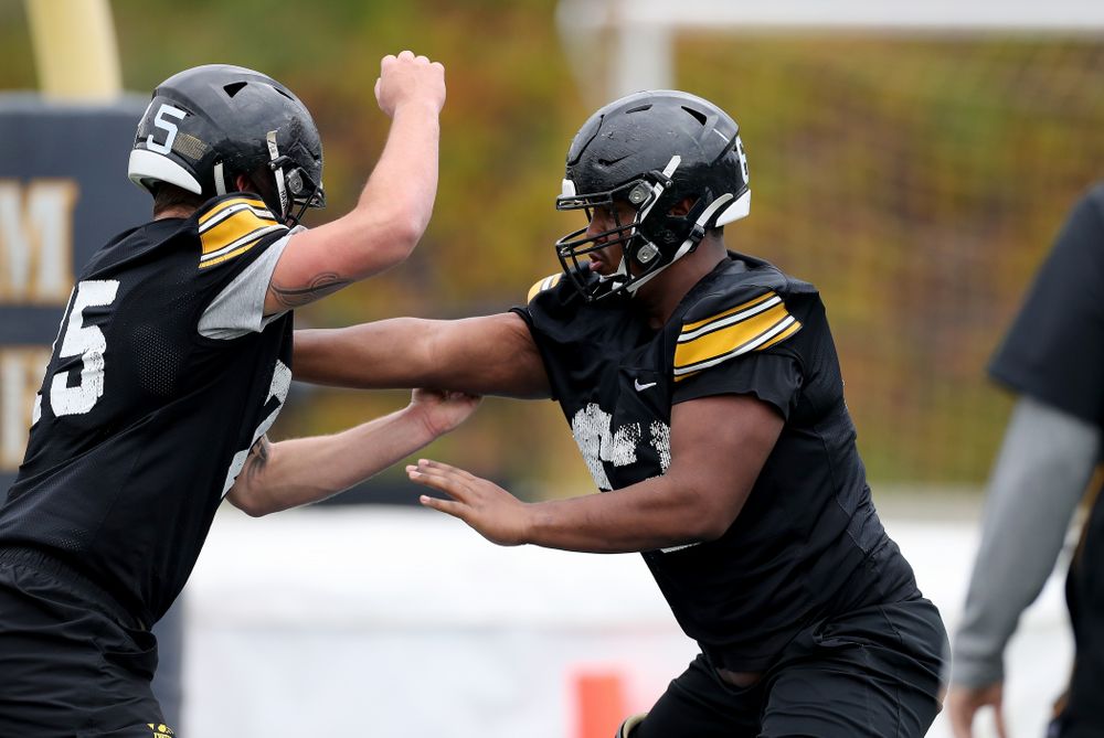 Iowa Hawkeyes offensive lineman Justin Britt (63) and offensive lineman Jeff Jenkins (75) during practice Sunday, December 22, 2019 at Mesa College in San Diego. (Brian Ray/hawkeyesports.com)