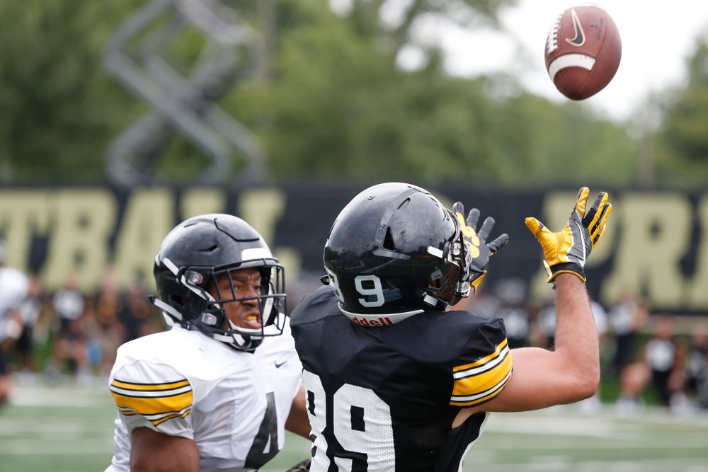 Iowa Hawkeyes wide receiver Nico Ragaini (89) and defensive back Josh Turner (4) during practice No. 4 of Fall Camp Monday, August 6, 2018 at the Hansen Football Performance Center. (Brian Ray/hawkeyesports.com)
