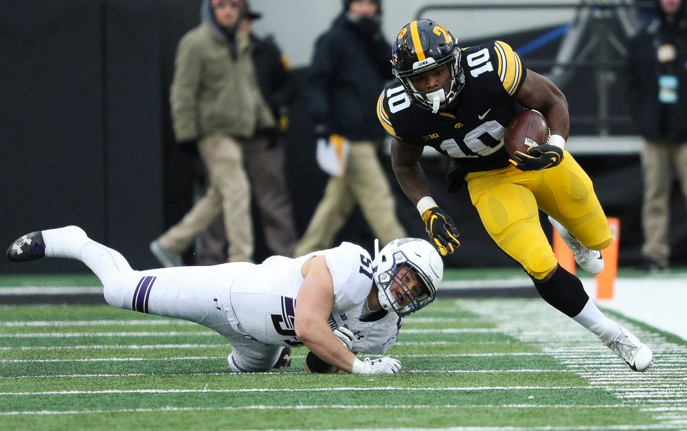 Iowa Hawkeyes running back Mekhi Sargent (10) breaks a tackle during a game against Northwestern at Kinnick Stadium on November 10, 2018. (Tork Mason/hawkeyesports.com)