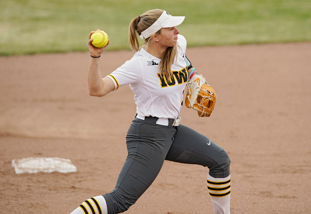 Iowa Hawkeyes Sydney Owens (5) throws to first base for an out during the sixth inning of their Big Ten Conference softball game at Pearl Field in Iowa City on Friday, Mar. 29, 2019. (Stephen Mally/hawkeyesports.com)