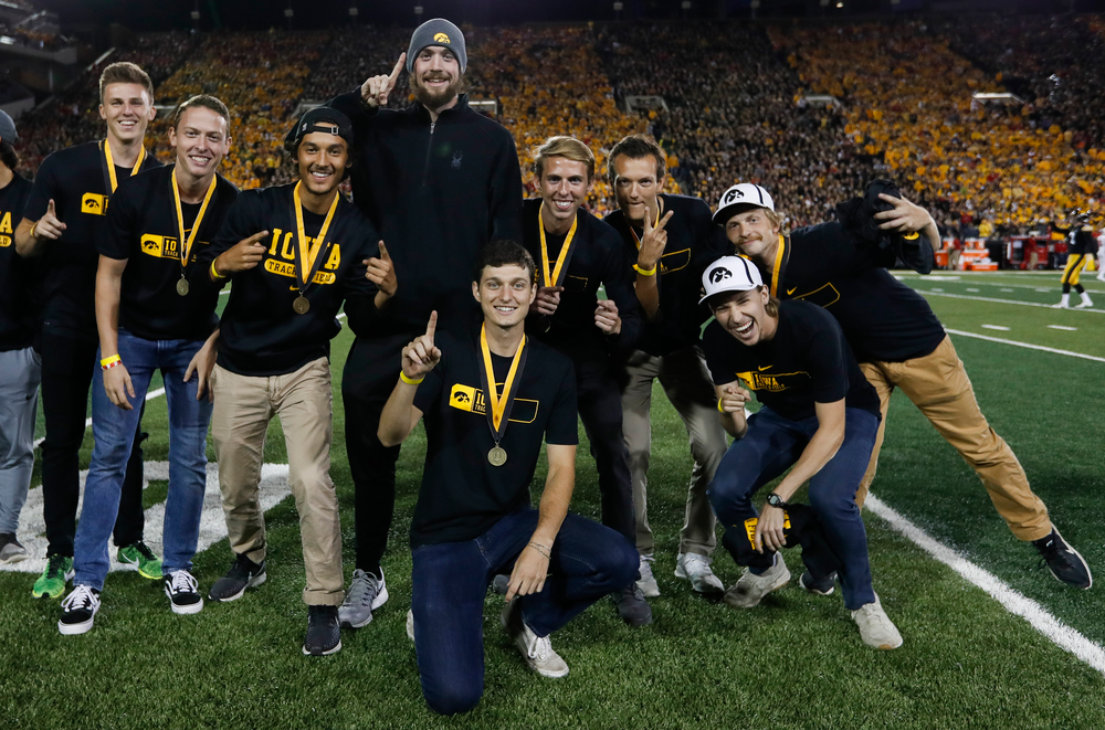 Members of the Iowa men's track and field team are recognized by the Presidential Committee on Athletics at halftime during a game against Wisconsin on September 22, 2018. (Tork Mason/hawkeyesports.com)