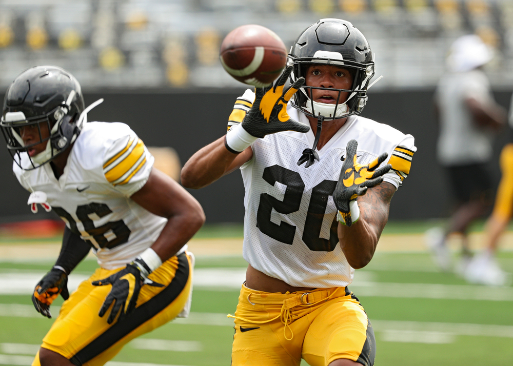 Iowa Hawkeyes defensive back Julius Brents (20) pulls in a pass during Fall Camp Practice No. 8 at Kids Day at Kinnick Stadium in Iowa City on Saturday, Aug 10, 2019. (Stephen Mally/hawkeyesports.com)