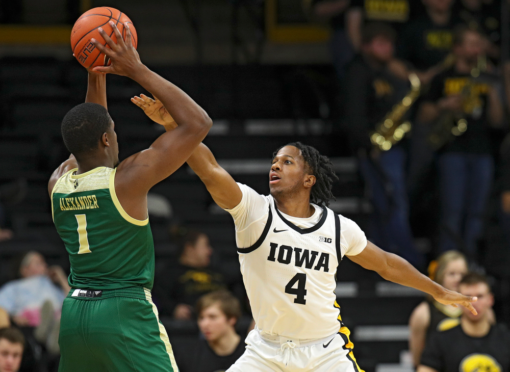 Iowa Hawkeyes guard Bakari Evelyn (4) defends during the second half of their game at Carver-Hawkeye Arena in Iowa City on Sunday, Nov 24, 2019. (Stephen Mally/hawkeyesports.com)