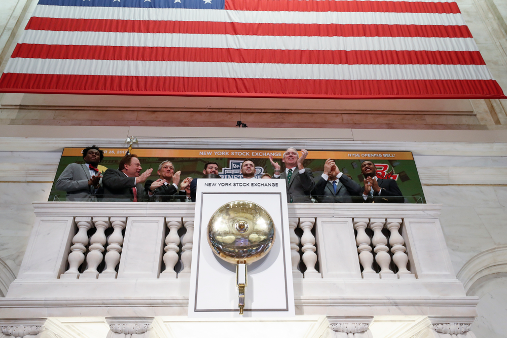 Iowa Hawkeyes linebacker Josey Jewell (43), defensive back Joshua Jackson (15), offensive lineman Sean Welsh (79) and head coach Kirk Ferentz ring the opening bell at the New York Stock Exchange Tuesday, December 26, 2017 in New York. (Brian Ray/hawkeyesports.com)